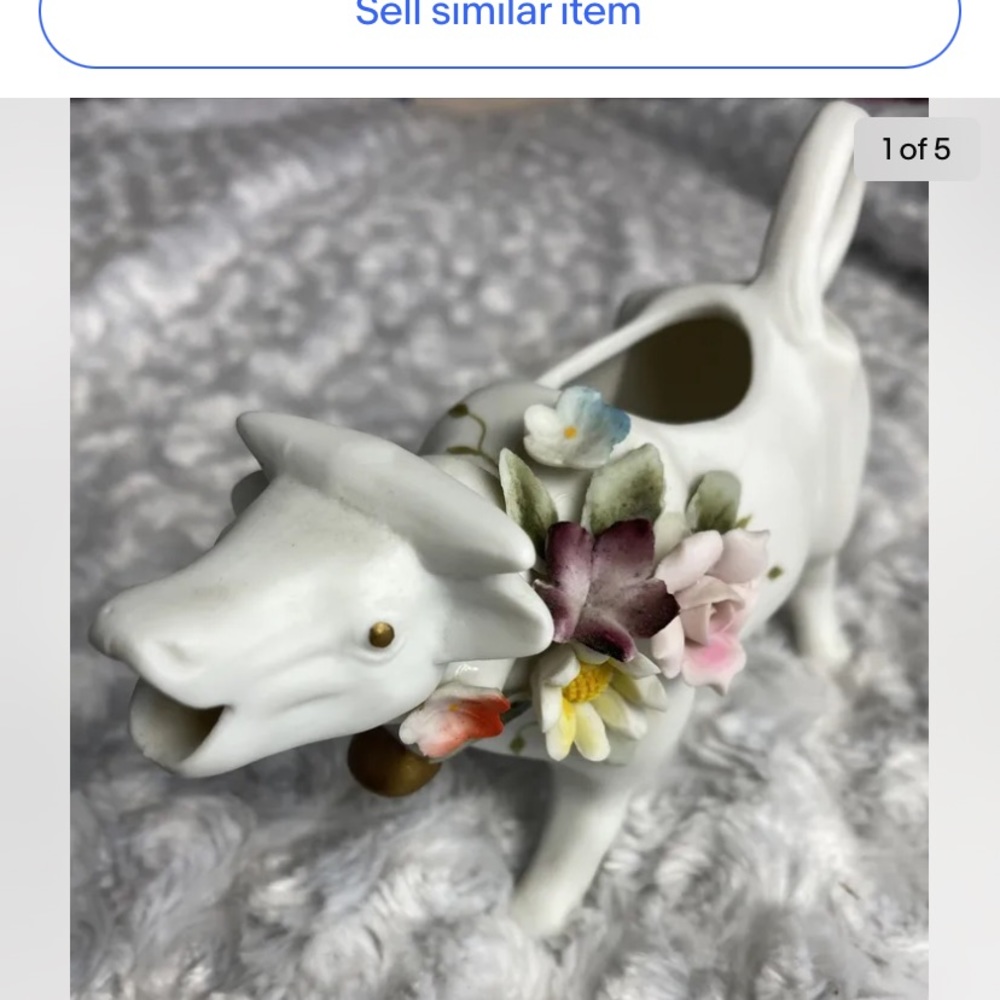 Cow creamer with applied flowers unglazed
